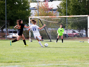 Outdoor soccer game in progress, representing the need for a sport shade tent to keep teams and spectators cool on the sidelines.