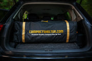 Alt Text: A Compact Shelter neatly stored in the trunk of a standard-sized vehicle, demonstrating its travel-friendly design and easy transportability.